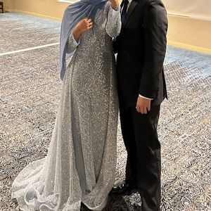 Fully beaded blue dress with attached overskirt. Size 10 but fits dress size 6/8